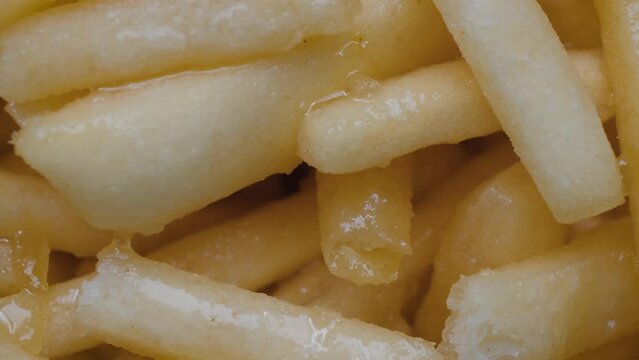 Top view: Chak Chak - fried crunchy honey cake on slow rotating surface - macro, close up. Traditional Tatar and Bashkir cuisine, oriental dessert, pastry, food and Tatarstan national sweet concept