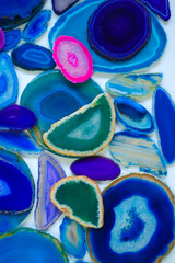 slices of natural stone . Agates set in blue and green colors.Texture of natural stone agate.blue Agate geode crystal.Cross section of a blue Brazilian geode 