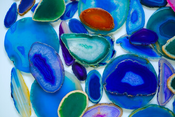 Wallpaper agate stones in blue and green colors.slices of natural stone on white background....