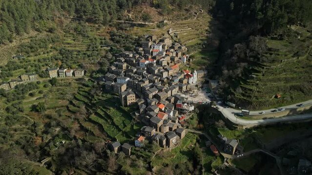 Aerial shot of Piodao a small village in the mountains of Portugal. Flying around the village and filming in 4K