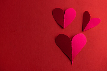 hand cut hearts over red