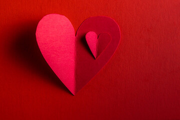 hand cut hearts over red