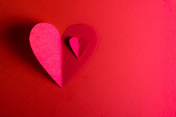 Obraz premium hand cut hearts over red