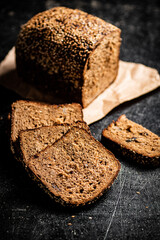 Sliced rye bread on paper. 