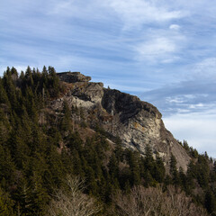 Cliffside with wispy clouds and blue sky