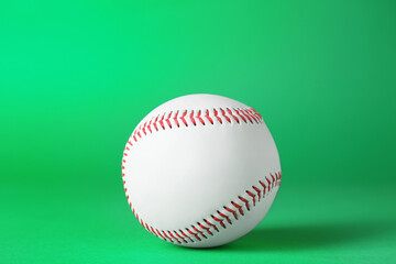 Baseball ball on green background, closeup. Sports game
