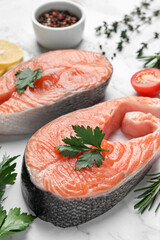 Fresh salmon and ingredients for marinade on white marble table