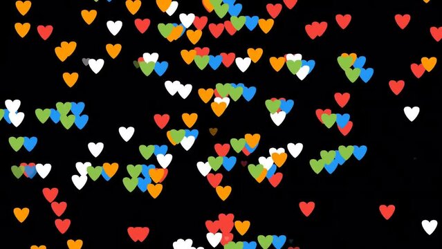 Colorful hearts confetti background. Seamless looping animation of falling coloful hearts on black background. Video effect for valentine's day and weddings. Green screen. Rain from hearts