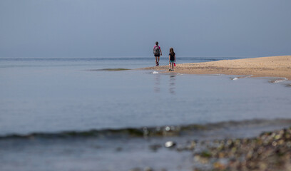 Fototapeta na wymiar walking on the beach -Race Point Beach, Cape Cod, Massachusetts 