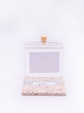  Wooden Aroma Sticks In A Glass Flask Filled With Flavor Liquid Substance Isolated Over White Background, Side View