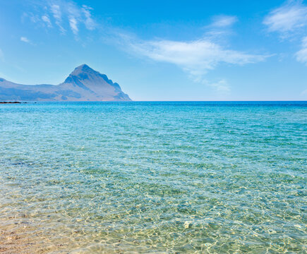 Azure Tyrrhenian sea picturesque bay and  Monte Cofano mount view near Bue Marino Beach, Macari, San Vito Lo Capo region, Sicily, Italy
