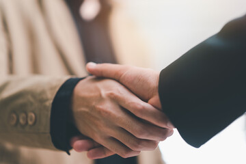 Businessmen shaking hands to indicate a business deal,successful contract management of the...