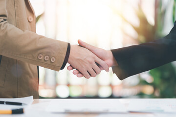 Businessmen shaking hands to indicate a business deal,successful contract management of the...