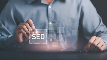 Marketer holding pen pointing to SEO icon, optimization analysis tools, search engine rankings,...