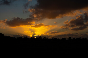 Sun setting with Sunbeam lighting the sky