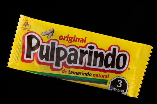 Image of a piece of "Pulparindo". Pulparindo is a bittersweet candy made of tamarind, chile, sugar and salt. It's labeled as unhealthy.