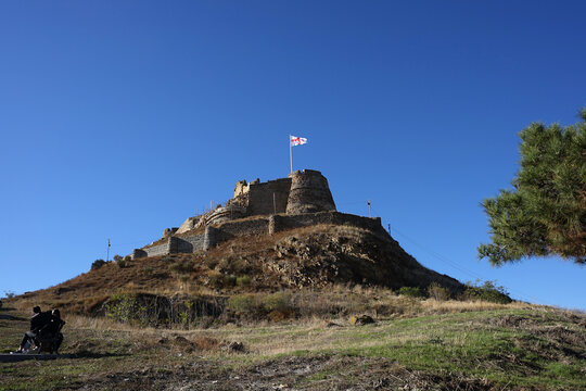 Gori, Georgia &ndash;22 October,2021 : The beautiful old ruin of Gori fortress on the hill of Gori town on the sunny day &ndash; 22 October,2022 in Gori, Georgia