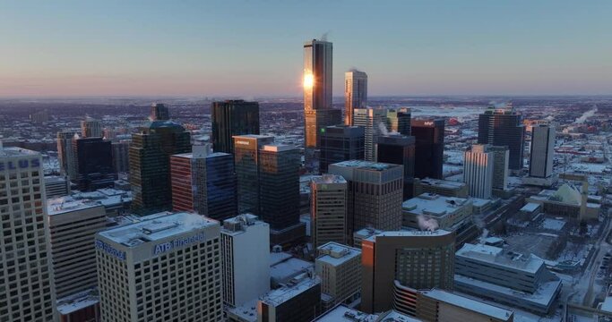  An aerial footage of downtown Edmonton's buildings and skyscrapers taken at dusk in the chilly winter