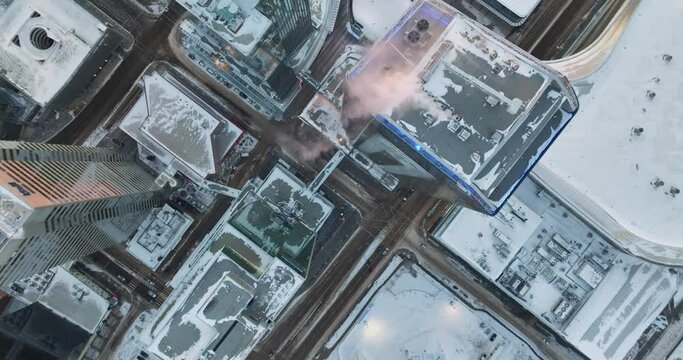 Top down Aerial view of snow-covered tall buildings in Edmonton, Alberta in cold winter weather