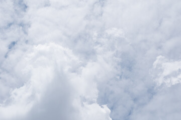 white clouds of various shapes with blue sky