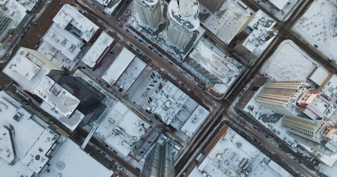 Top down Aerial view of snow-covered tall buildings in Edmonton, Alberta in cold winter weather