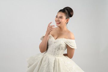 Fototapeta na wymiar Young asian beautiful bride smiling with happy on white background