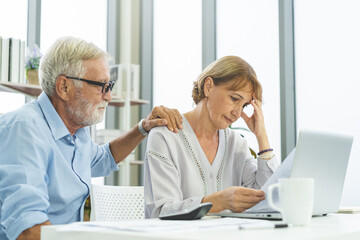 Stressed husband, wife senior couple elderly family, caucasian mature, retired calculate budget from invoice, expense or bill, no money to pay. Mortgage, loan causing debt, bankruptcy of financial.