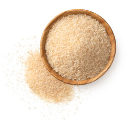 Psyllium husks in the wooden bowl, isolated on white background, top view.