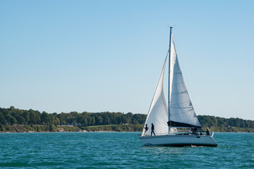 Fototapeta na wymiar A sailboat of the shore of Lake Michigan near Soouth Haven, Michigan.