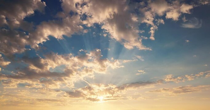 Skyline view of heaven flying fluffy clouds and shining sun rays 4k video. Sunlight, cloudscape and sunrise sky time lapse.