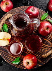 Apple juice on a wooden tray. 