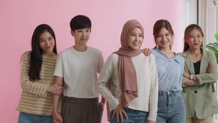 Group of young people Gen Z talent workforce relax smile look at camera standing studio shot shooting. Power of diverse asia girl woman, youth LGBT gay lesbian, islam female lady unity in women's day.