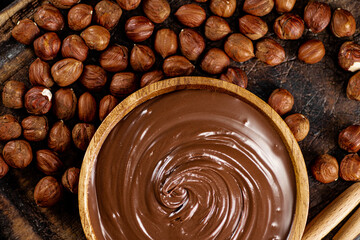 Hazelnut butter in a plate on a cutting board. 