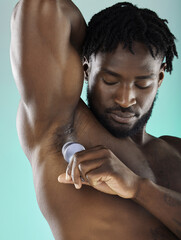 Odor, hygiene and black man with armpit deodorant isolated on a blue background in studio....