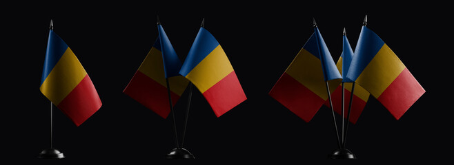 Small national flags of the Chad on a black background