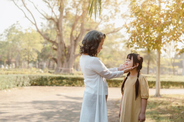 Naklejka premium Portrait of asia grandmother and grandchildren holiday vacation together in the park in the summer in Southeast Asia Pacific.