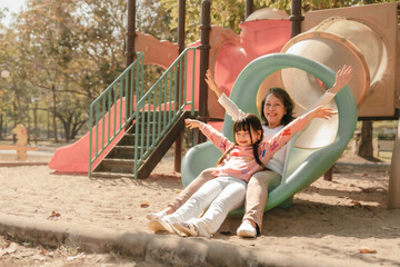 Portrait of asia grandmother and grandchildren holiday vacation together in the park in the summer in Southeast Asia Pacific. playground