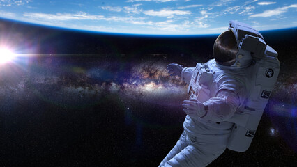 Obraz na płótnie Canvas astronaut during spacewalk in Earth orbit