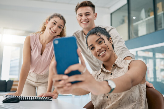 Phone, selfie and friends with a business team taking a photograph for social media together in an office. Teamwork, collaboration or internet with a man and woman employee group posing for a picture