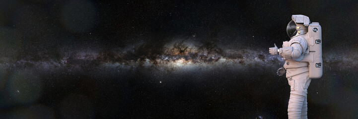 astronaut showing thumbs up during spacewalk, background banner with empty space (