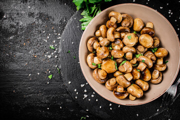 Delicious fried mushrooms in a bowl. 