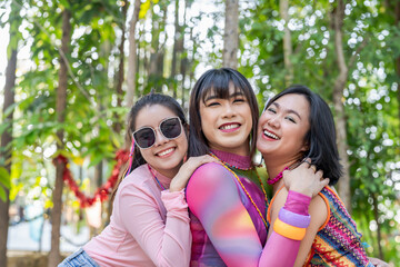 Group of friends LGBTQ having fun together happy Thai transgender Asian woman LGBTQIA at music festival LGBT