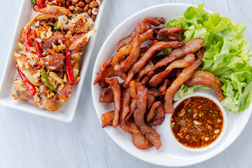 Fried Sun-Dried Pork and Fermented Pork Delicious hands on the table