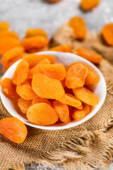 Fragrant dried apricots in a bowl on the table. 