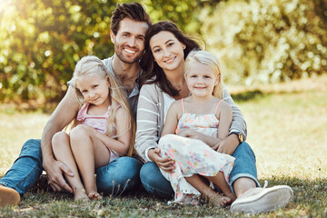 Fototapeta premium Family, garden and portrait of parents, children and happy people on park grass in sunshine. Kids, mom and dad smile with love in nature, holiday and summer vacation to relax on park lawn with peace