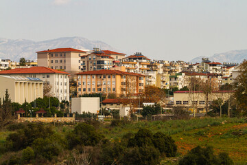 Fototapeta na wymiar Side, Turkey -January 21, 2023: Colorful Turkish streets with low houses, palms