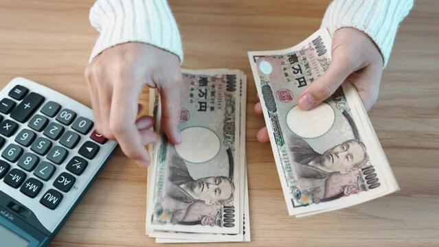 hand counting Japanese Yen banknote. Thousand Yen money. Japan cash, Tax, Recession Economy, Inflation, Investment, finance, savings, salary and payment concepts