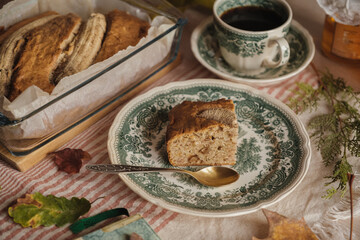 warm cupcake and coffee with antique dishes