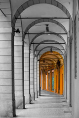 Narrow city street view traditional architectural features in Bologna, Italy