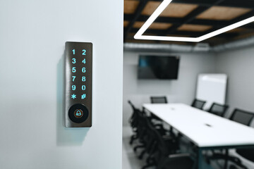 Electronic digital door lock on white office wall